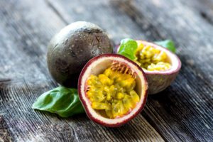Sliced passion fruit on wood surface