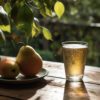pears in an orchard with beer | Puree Arete photo of pears on a plate in an orchard next to a pint of beer