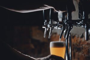photo of Light Draft cold beer pour in glass from crane in pub