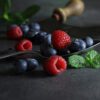 mystic light blueberries on a dark background | Puree Arete link to 2025 Fruit Treds article