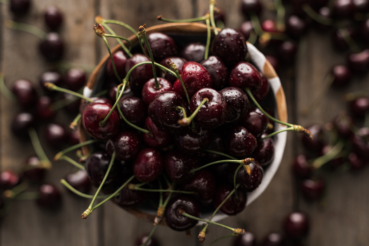 top view of red fresh whole and ripe cherries covered with dro | Puree Arete Sweet cherries for fruit puree photo